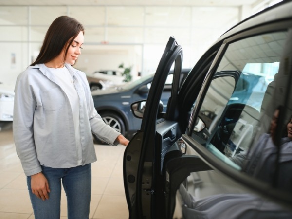 Woman Closing a Car Door
