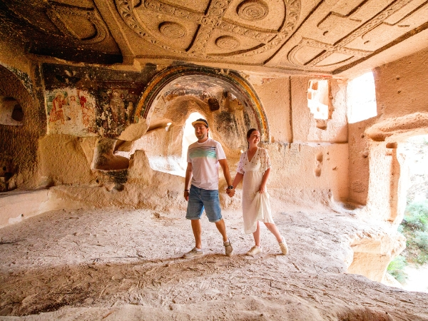 Couple Touring Underground in Cappadocia Turkey